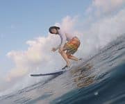 Mid length shape surfboard down the line